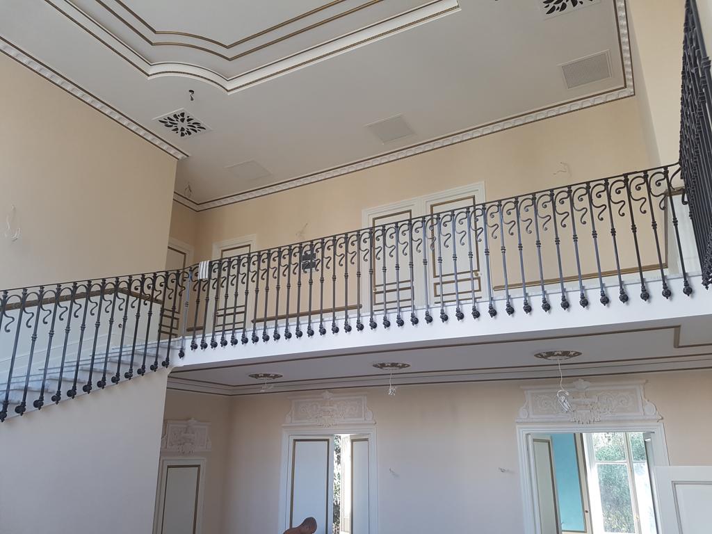 Renovation: staircase with iron railing